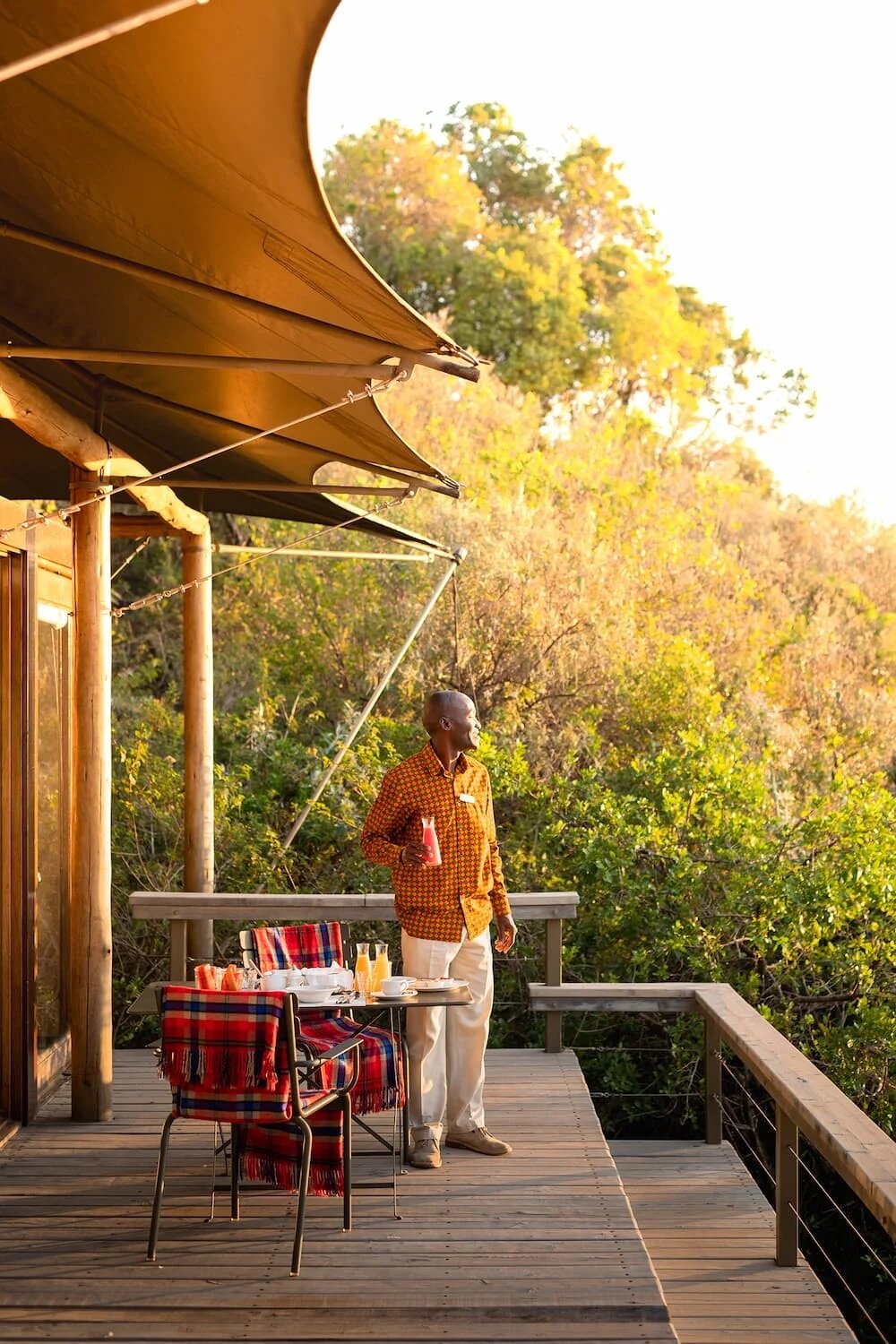 Private deck dining suspended over the Great Rift at Angama Mara